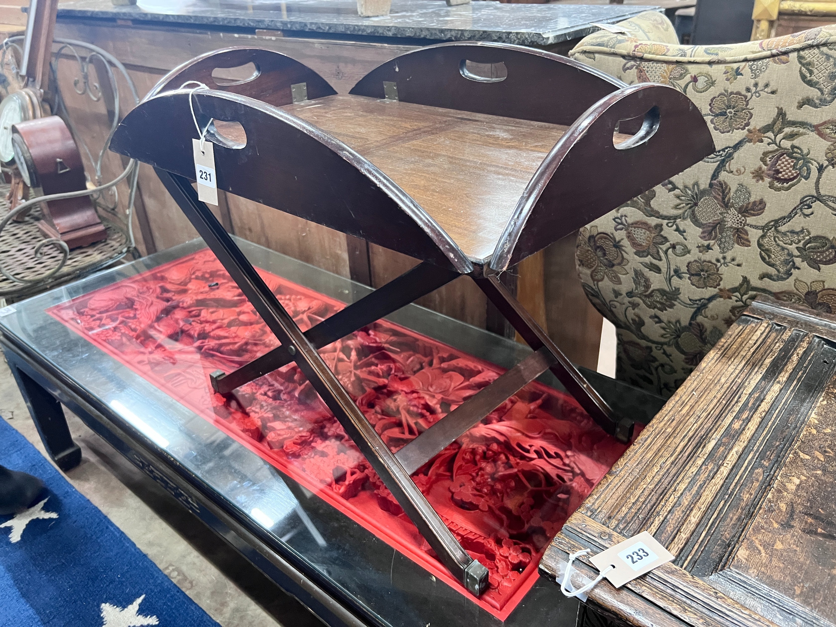 A mahogany butler's tray on folding stand, width 70cm *Please note the sale commences at 9am.